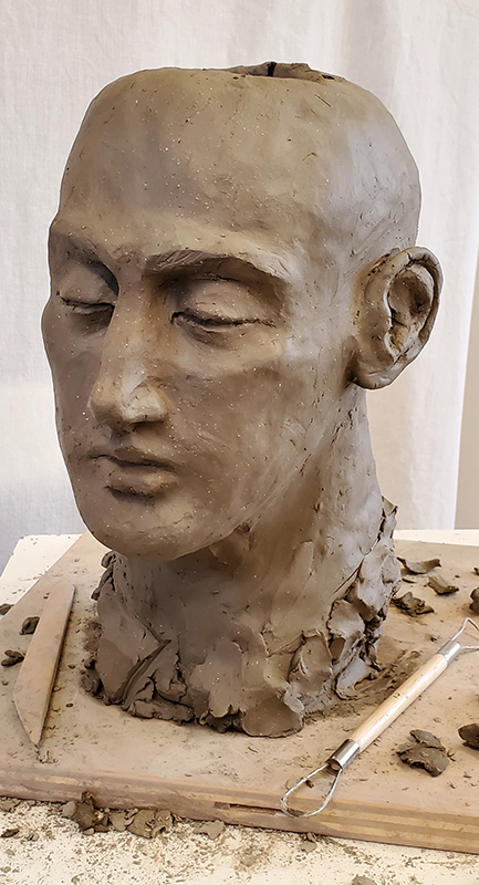 clay sculpture in progress human head