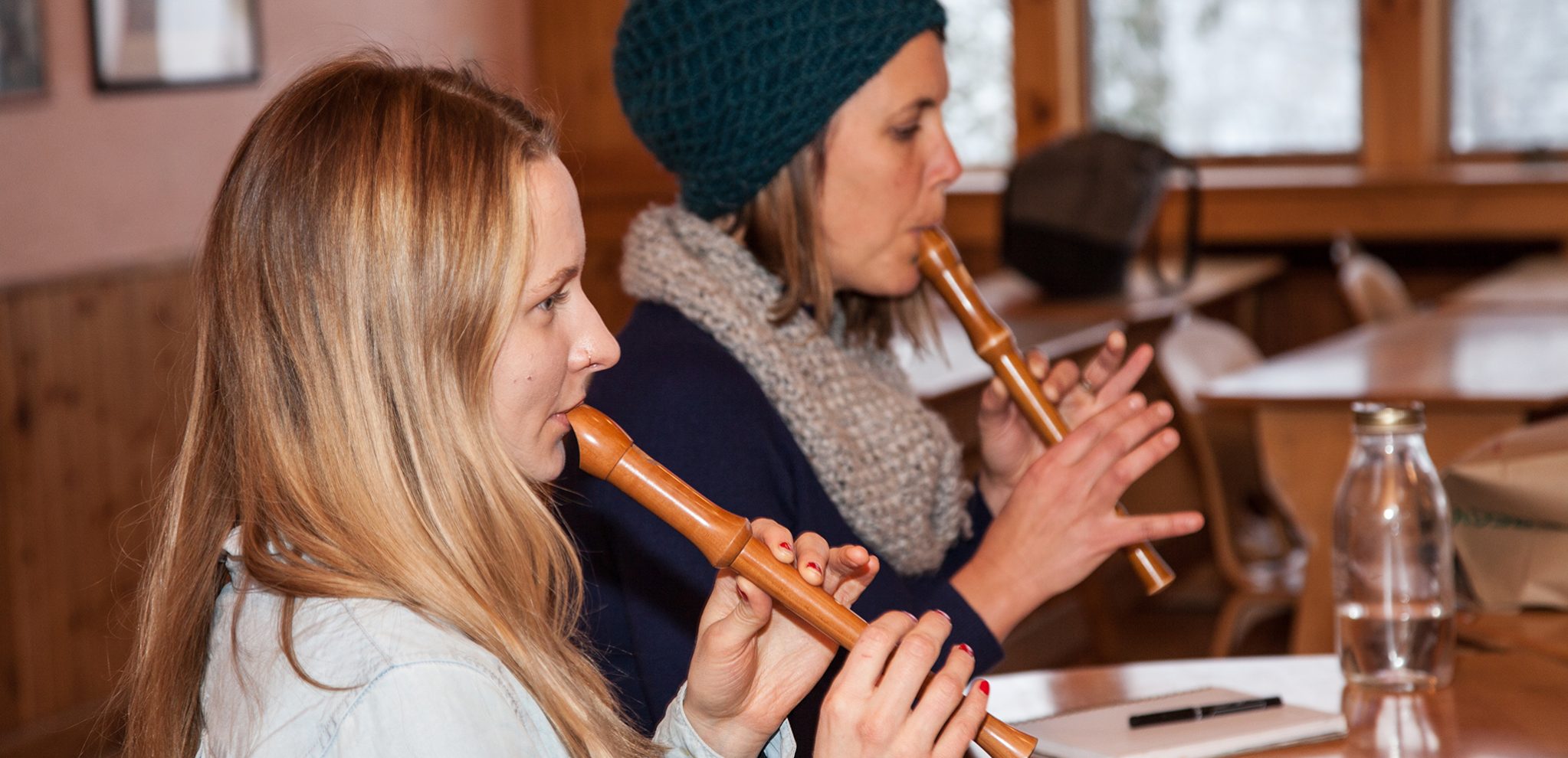 Two Alkion students playing the recorder.